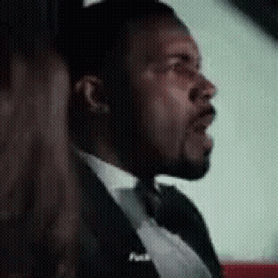 Man In Tuxedo And Bow Tie Sitting In Car With Woman GIF
