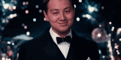Man In Tuxedo And Bow Tie Smiles GIF