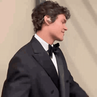 Man In Tuxedo And Bow Tie Smiling GIF