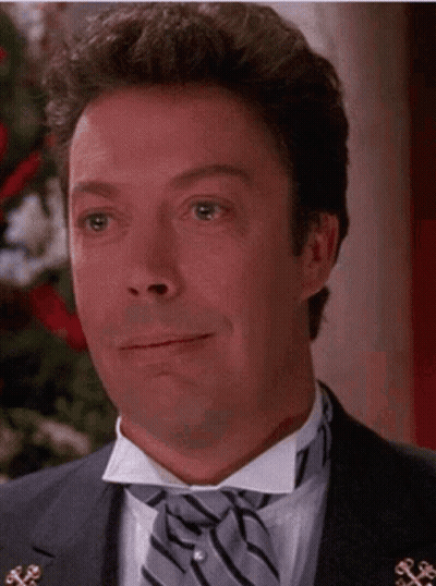 Man In Tuxedo And Bow Tie Smiling GIF