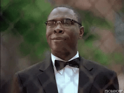 Man In Tuxedo And Bow Tie Smiling With Glasses GIF
