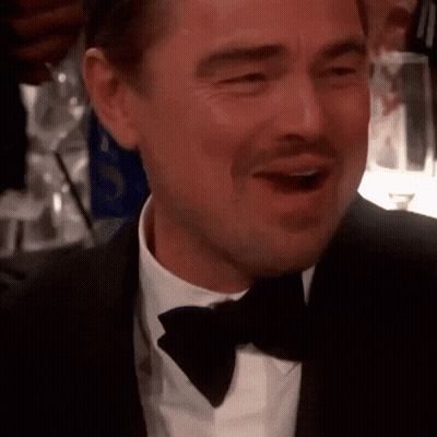 Man In Tuxedo And Bow Tie Smiling With Mouth Wide Open GIF