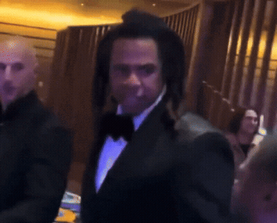 Man In Tuxedo And Hat Standing GIF