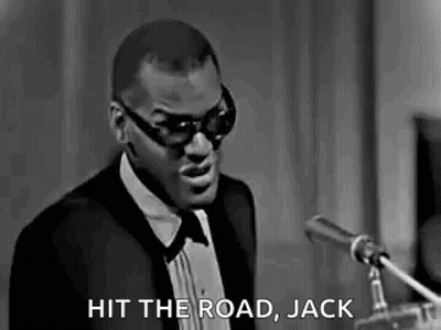 Man In Tuxedo And Sunglasses At Microphone GIF