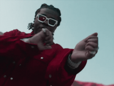 Man In Tuxedo And Sunglasses Hand On Stomach GIF