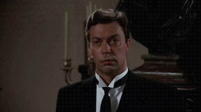 Man In Tuxedo And Tie Looking At Camera GIF