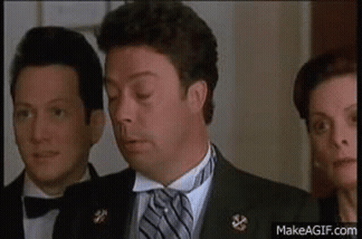 Man In Tuxedo And Tie Next To Two Men In Bow Ties GIF
