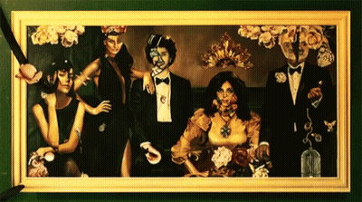 Man In Tuxedo And Two Women GIF