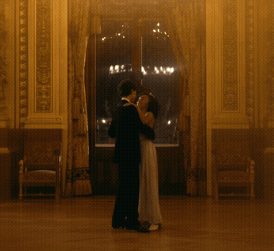 Man In Tuxedo And Woman Dancing GIF