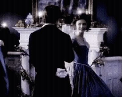 Man In Tuxedo And Woman In Blue Dress Dancing GIF