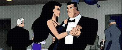 Man In Tuxedo And Woman In Dress Dancing GIF