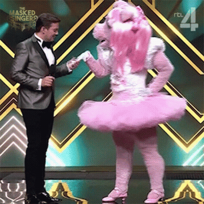 Man In Tuxedo And Woman In Pink Ballerina Costume GIF