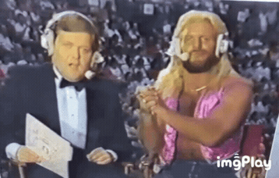 Man In Tuxedo And Woman In Pink Dress Sitting Together GIF