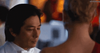 Man In Tuxedo And Woman In Red Dress GIF