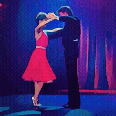 Man In Tuxedo And Woman In Red Dress Dancing GIF