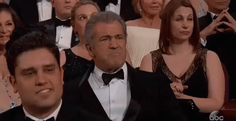 Man In Tuxedo At Awards Ceremony GIF