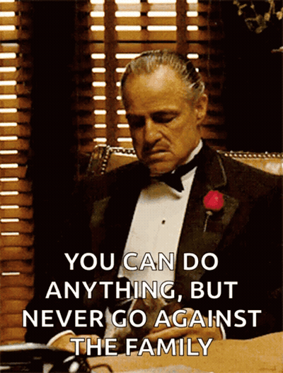 Hombre de esmoquin en escritorio diciendo puedes hacer cualquier cosa GIF