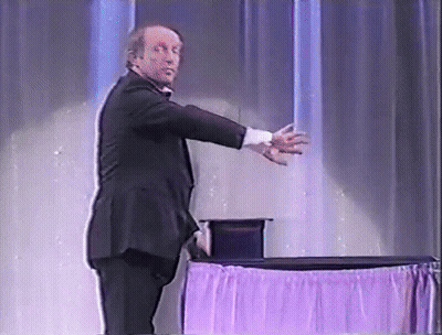 Man In Tuxedo At Purple Tablecloth GIF