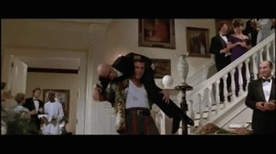 Man In Tuxedo Carrying Another Man On Shoulders GIF