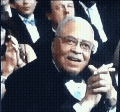 Man In Tuxedo Clapping In Crowd GIF