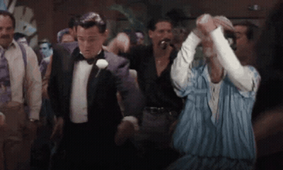 Man In Tuxedo Dancing With Man In Striped Shirt GIF
