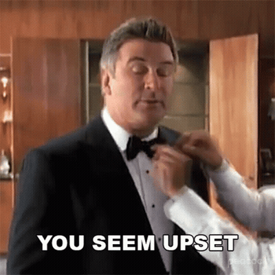 Man In Tuxedo Getting Bow Tie Adjusted By Man In White Shirt GIF