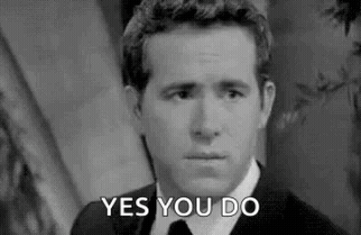Man In Tuxedo Holding Bell Like A Butler GIF