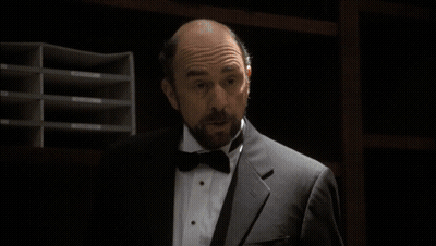 Man In Tuxedo Holding Born In Congress Pamphlet GIF