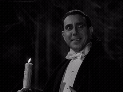 Man In Tuxedo Holding Candle GIF