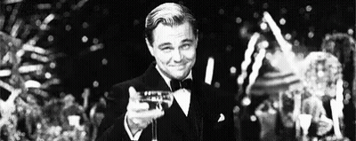 Man In Tuxedo Holding Champagne GIF