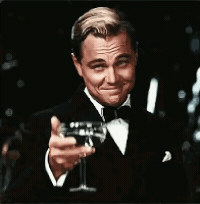 Man In Tuxedo Holding Champagne GIF