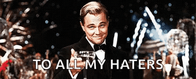 Man In Tuxedo Holding Champagne To All My Haters GIF