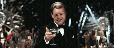 Man In Tuxedo Holding Champagne GIF