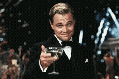 Man In Tuxedo Holding Champagne GIF