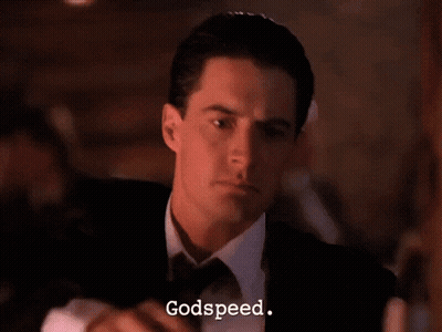 Man In Tuxedo Holding Gun GIF