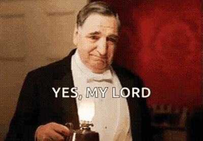 Man In Tuxedo Holding Lamp Saying Yes My Lord GIF