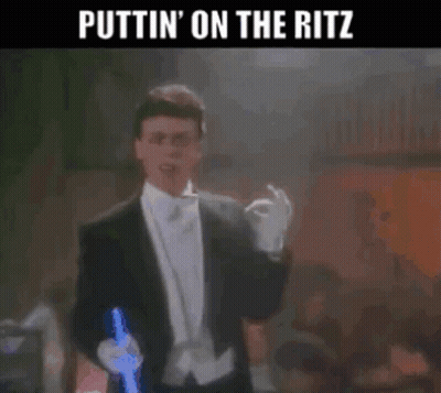 Man In Tuxedo Holding Lightsaber Puttin On The Ritz GIF