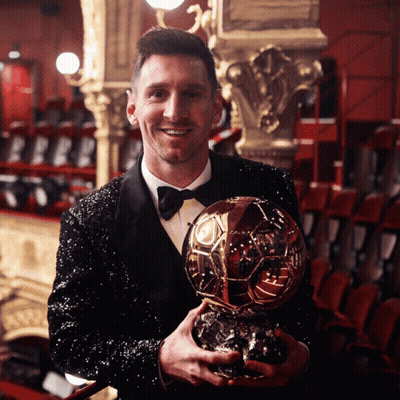 Man In Tuxedo Holding Trophy Saying Lionel Messi GIF
