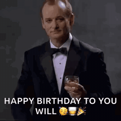 Man In Tuxedo Holding Whiskey GIF