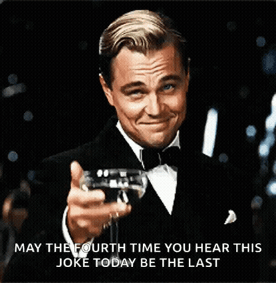 Man In Tuxedo Holding Wine GIF