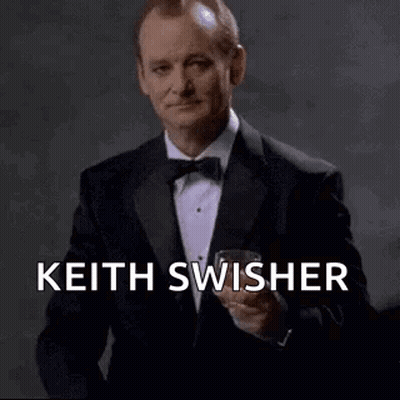 Man In Tuxedo Holding Wine Glass GIF