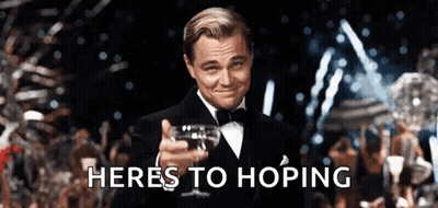 Man In Tuxedo Holding Wine Saying Heres To Hoping GIF