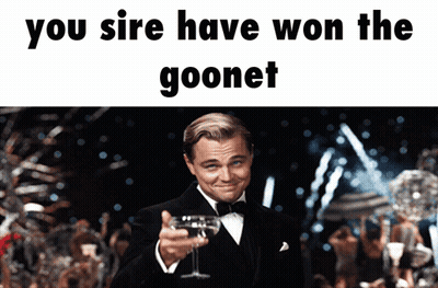 Man in Tuxedo Holding Wine Saying You Sire Have Won the Goonet