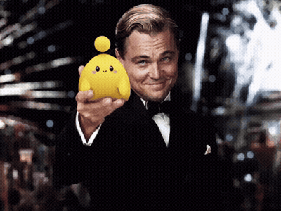 Man in Tuxedo Holding Yellow Toy With Face
