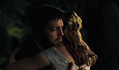 Man In Tuxedo Hugging Woman In White Dress GIF