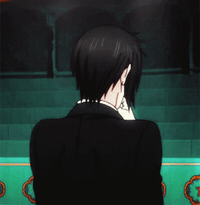 Man In Tuxedo In Front Of Green Wall GIF