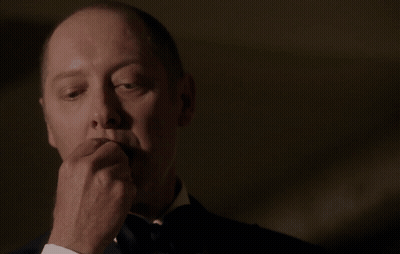 Man In Tuxedo In Front Of Red BP Sign GIF