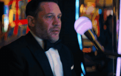 Man In Tuxedo In Front Of Slot Machine With Word Ke GIF