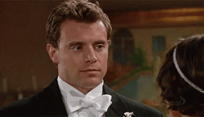 Man In Tuxedo Looking At Woman GIF