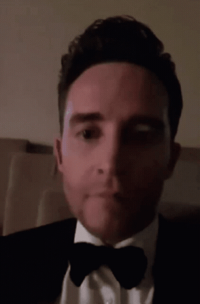 Man In Tuxedo Making Funny Face GIF